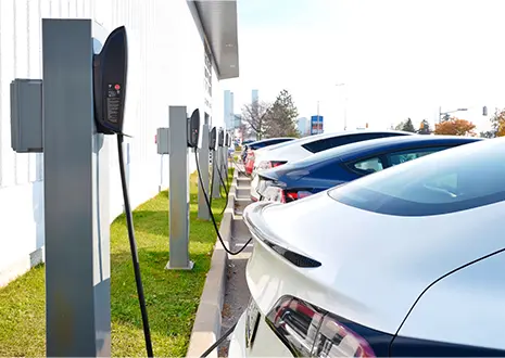 The picture shows e-cars charging at the charging station.