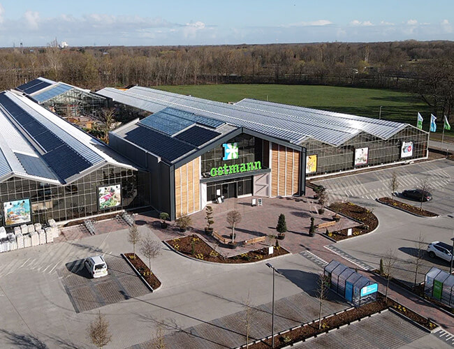 The image offers a bird's eye view of the exterior of the Ostmann garden center in Oldenburg.